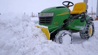 Plowing Deep Snow with a Lawn Tractor [upl. by Fawcette218]